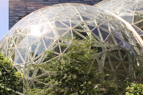 a large glass dome with a clock on the side of it