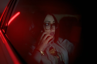 A friendly customer service representative wearing a headset ready to assist with auto glass inquiries.