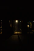 Cinematic still of a dimly lit luxury interior with deep shadows.
