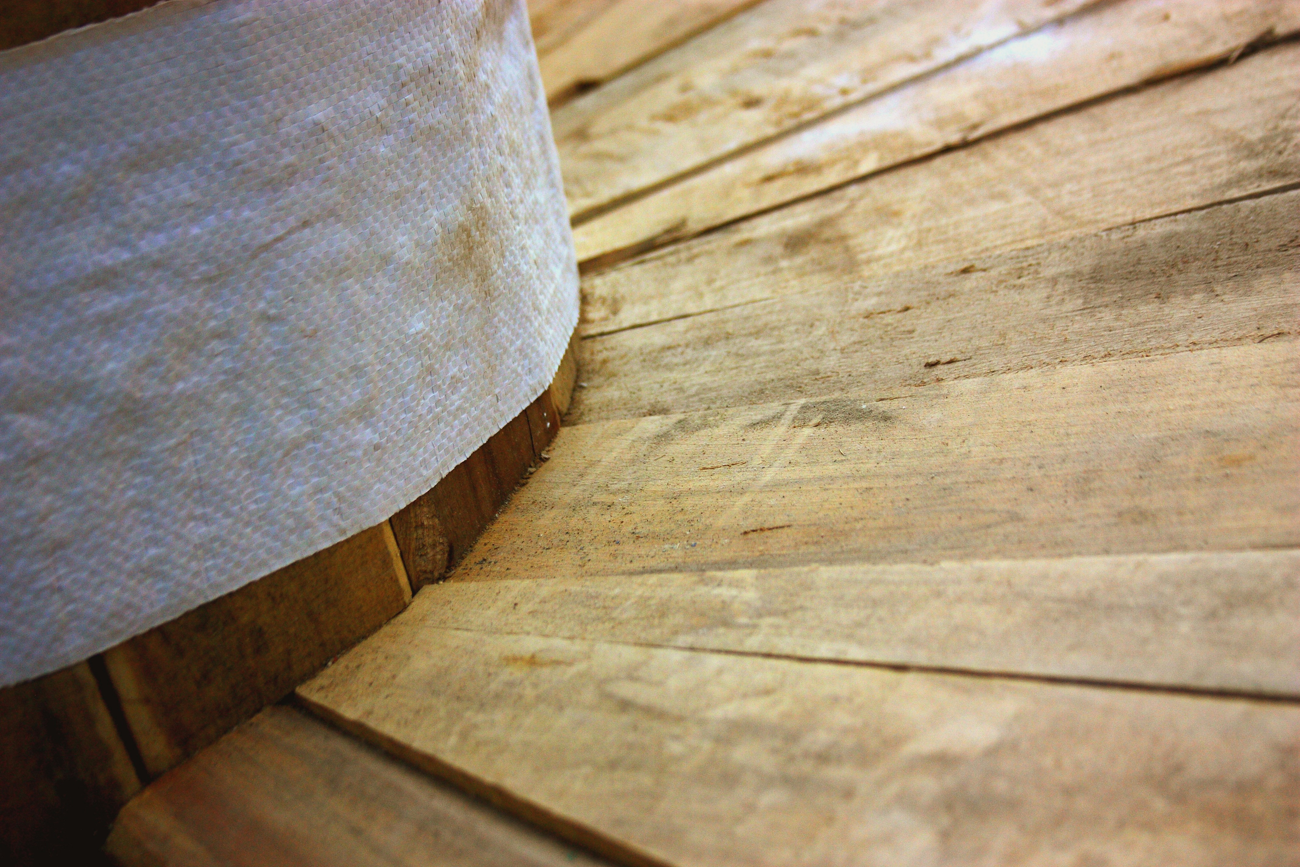 a close up of a wooden table with a lamp on top of it