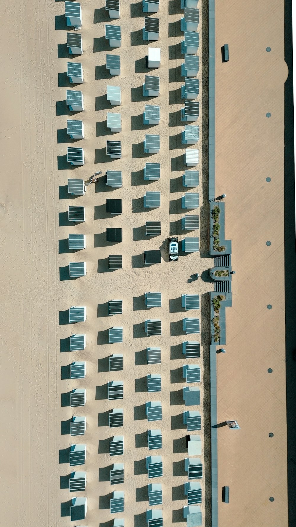 an aerial view of a beach and a building