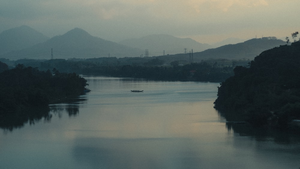 a body of water with a boat in the middle of it