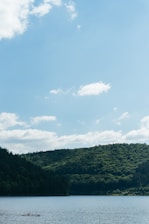 A serene landscape depicting a family discussing their financial future with a financial advisor.