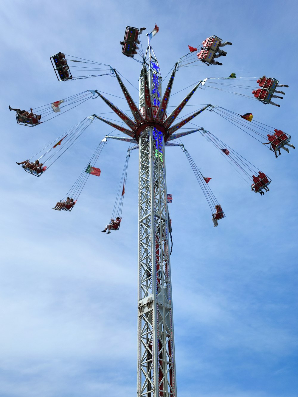 a carnival ride with people riding on it