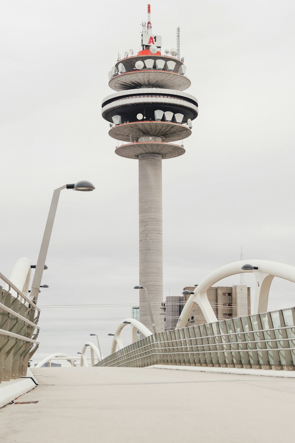 a bridge with a tower in the background