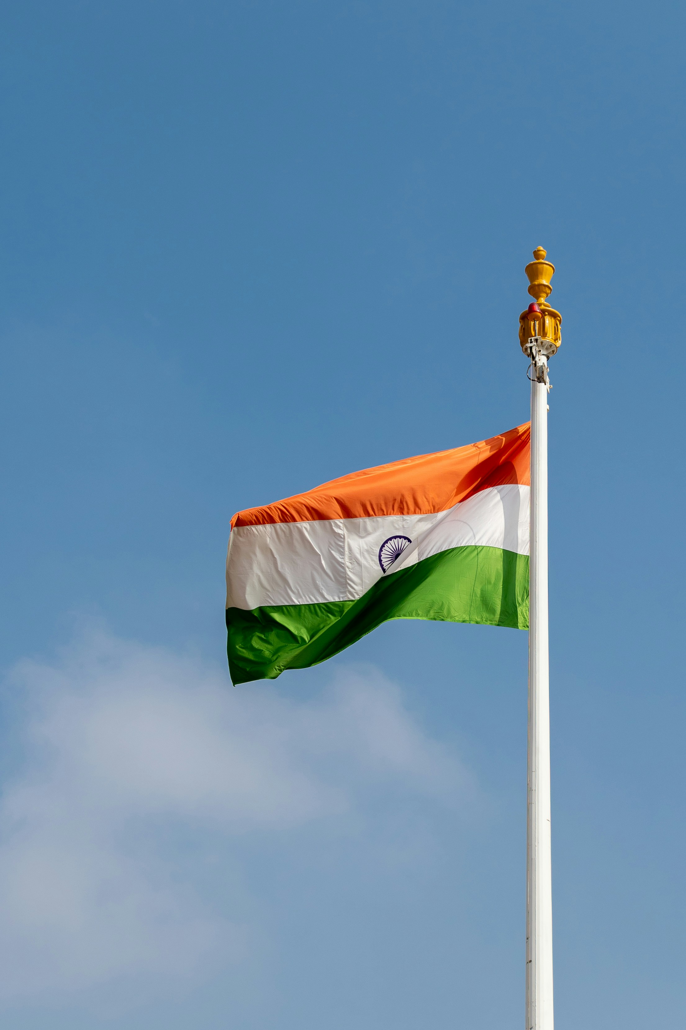 the indian flag is flying high in the sky