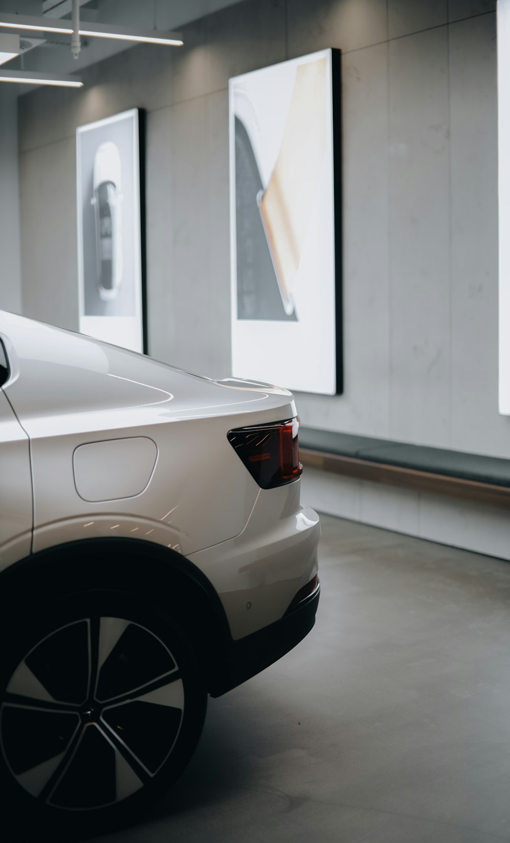 a white car parked in a parking garage