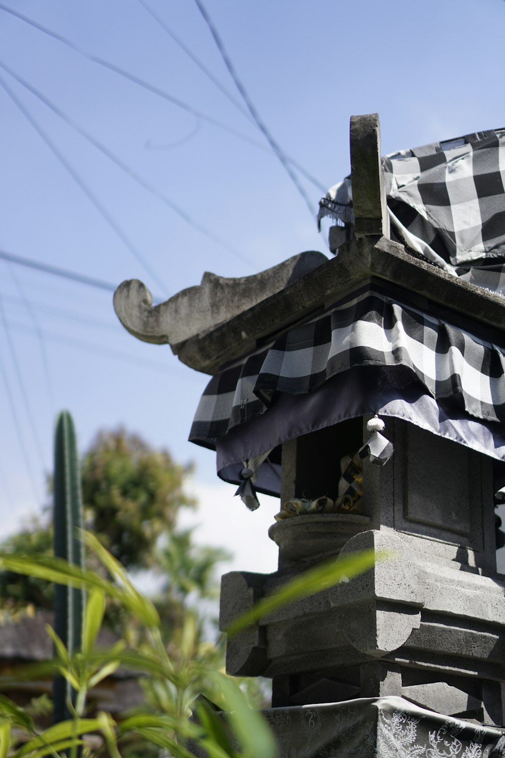 a black and white checkered umbrella on top of a building