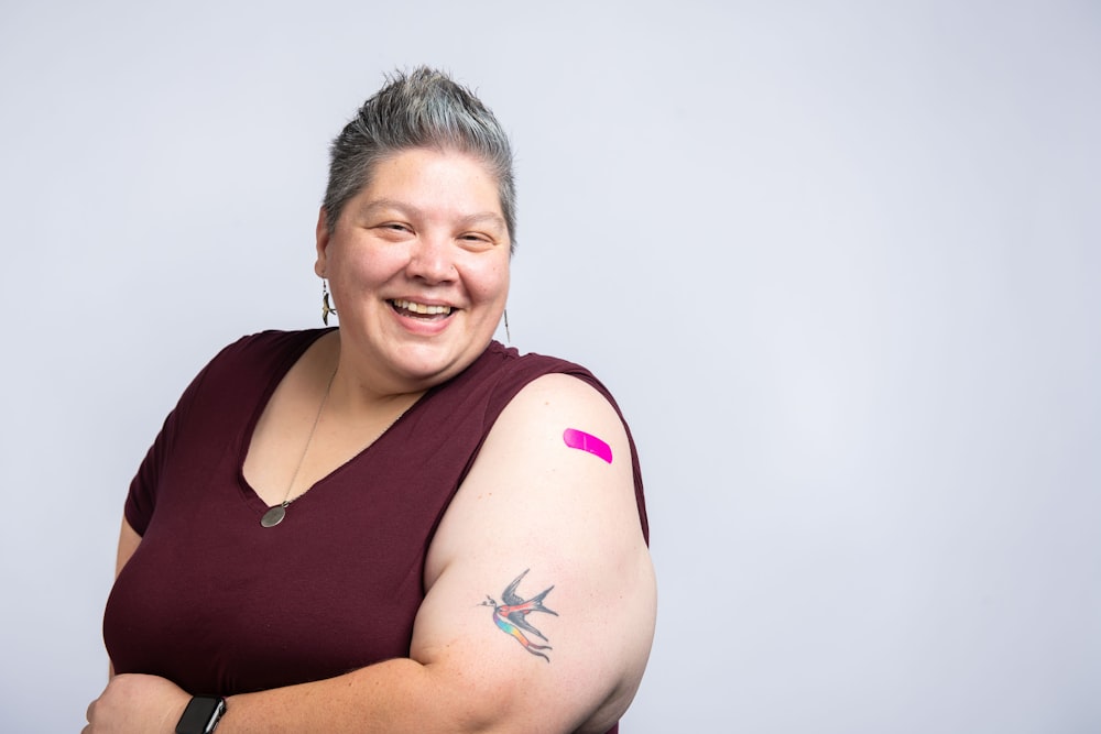 a woman with a tattoo on her arm