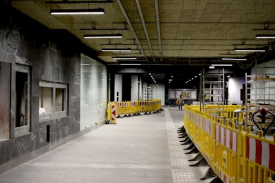 a large building with a yellow and red barricade