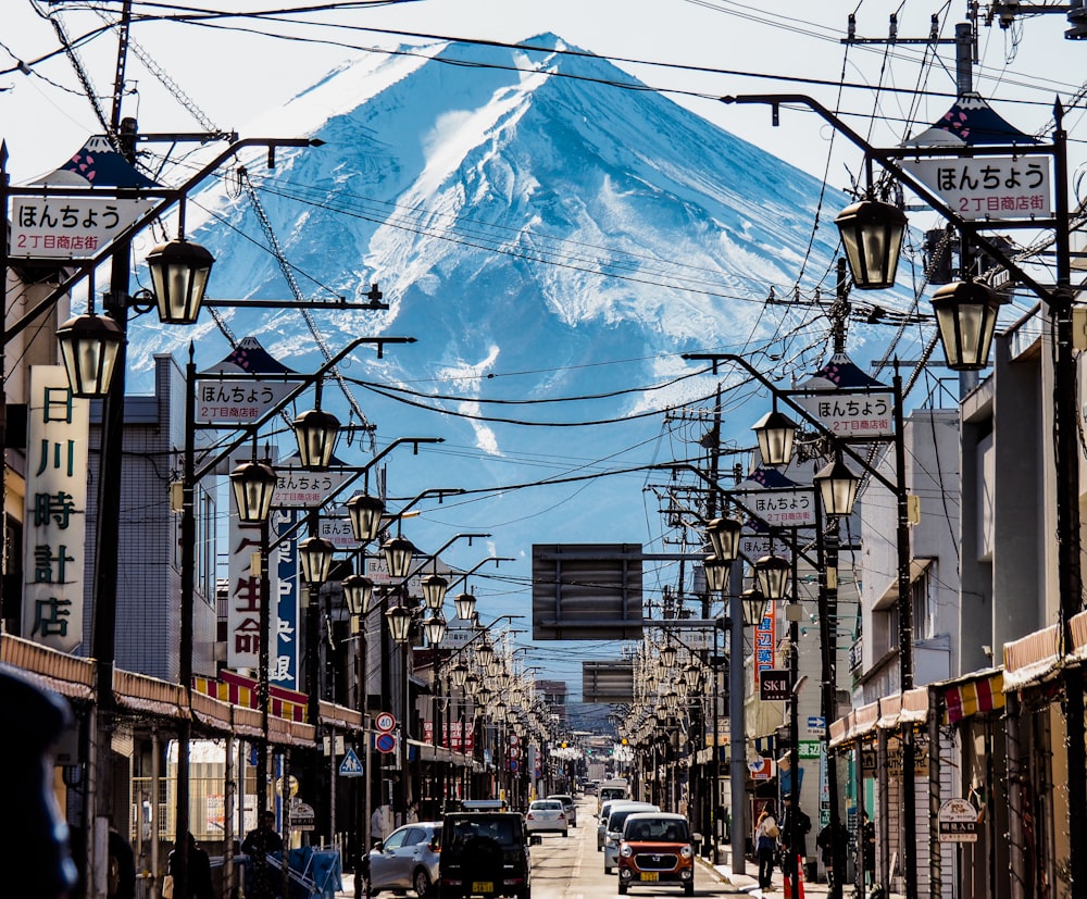 a city street with a mountain in the background