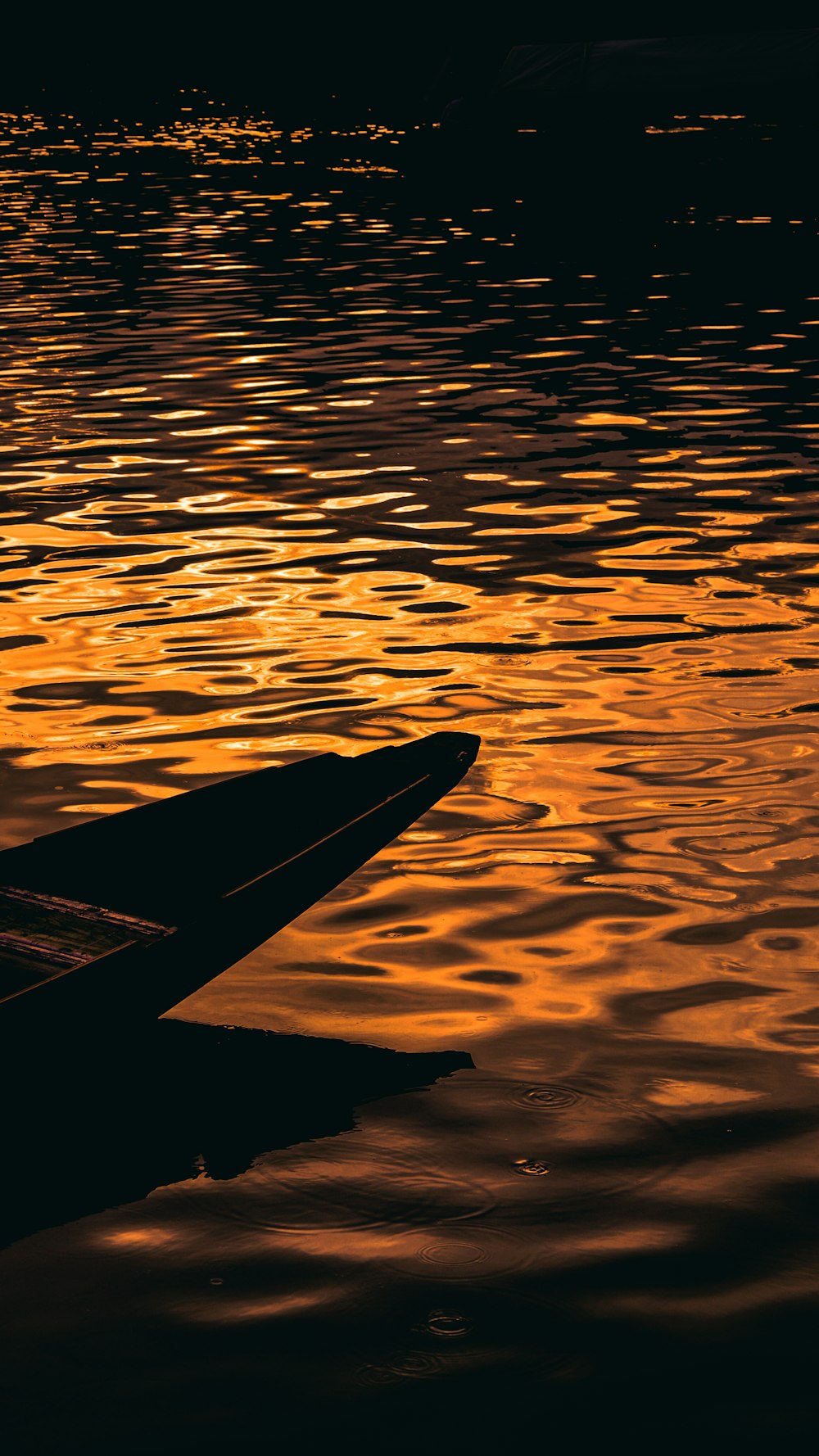 a boat floating on top of a body of water