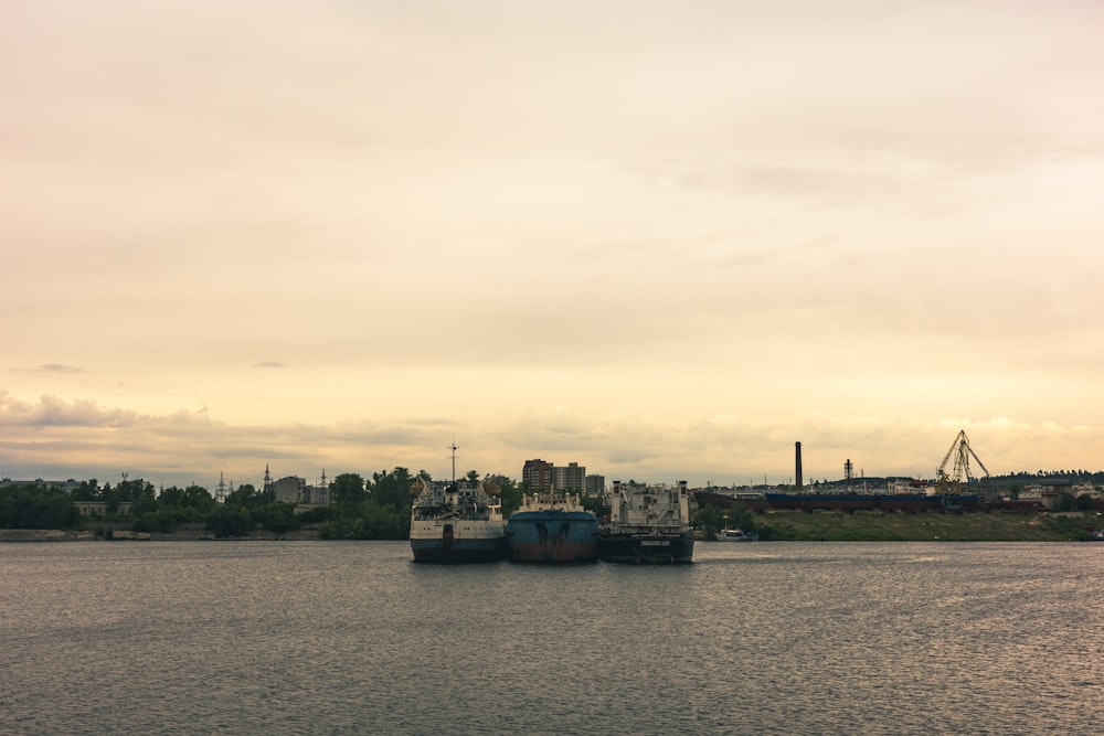 two large ships are docked in the water