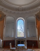 Elegant Mediterranean-style living room with bright natural light.