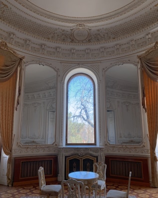 Elegant Mediterranean-style living room with bright natural light.