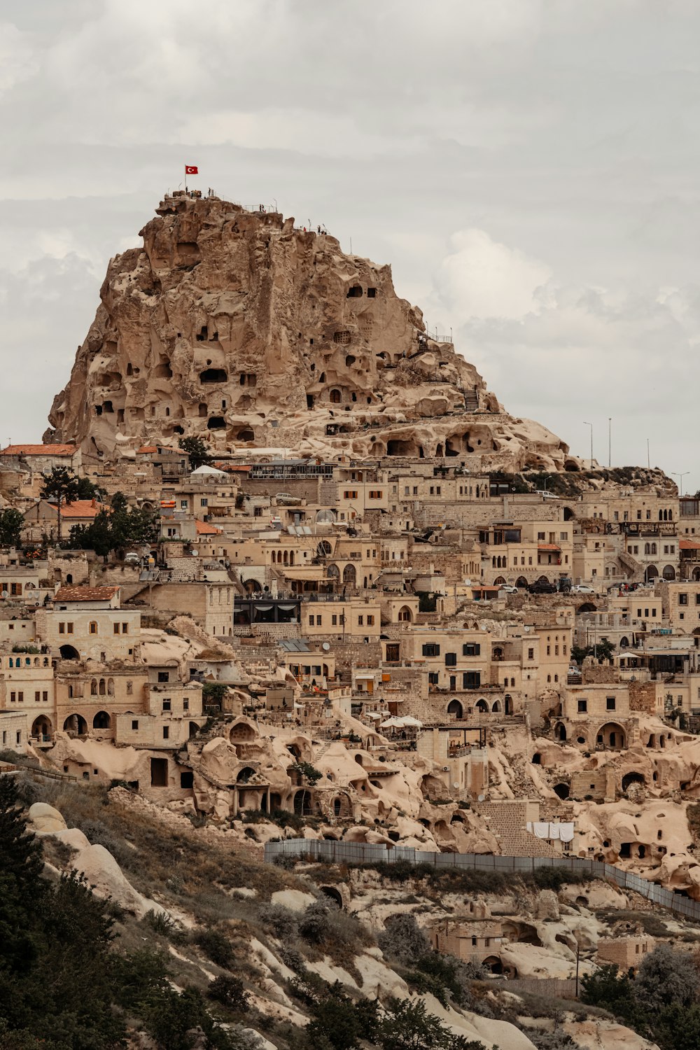 a mountain with a bunch of buildings on top of it