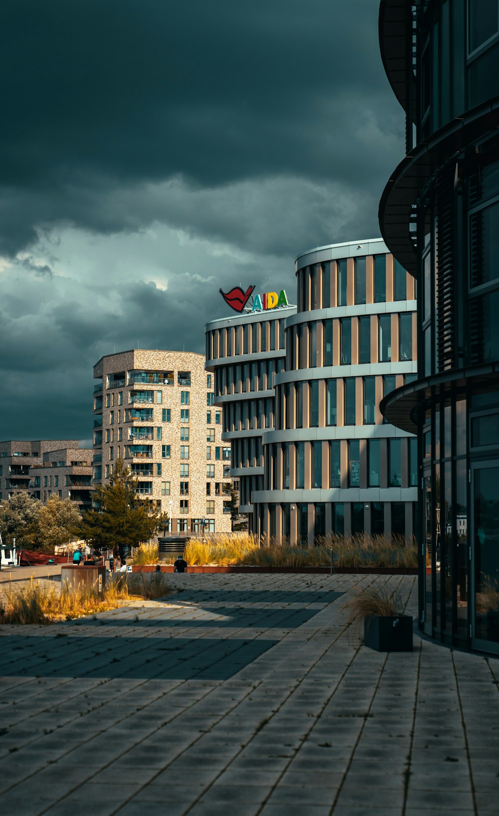 a large building with many windows and a cloudy sky