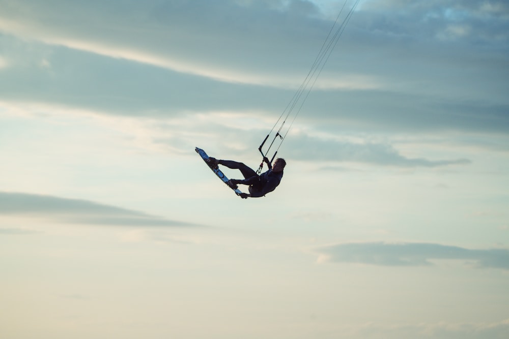 a person on a surfboard in the air