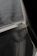 Close-up of a newly installed mosquito net on a balcony window with sunlight filtering through.