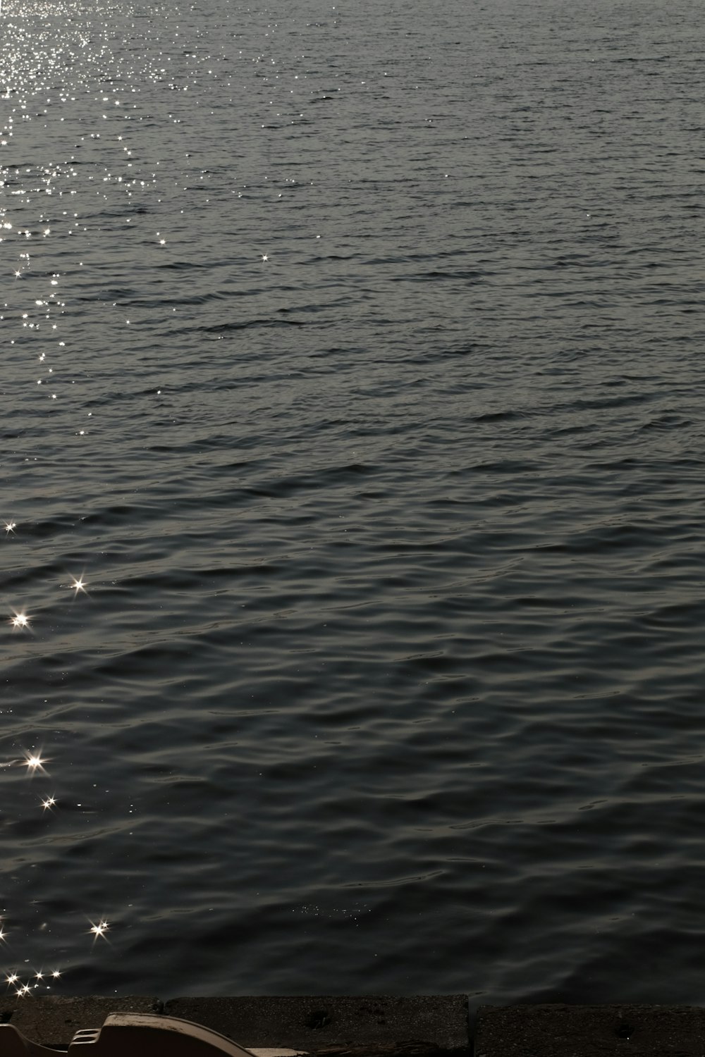 a view of a body of water with a boat in the distance