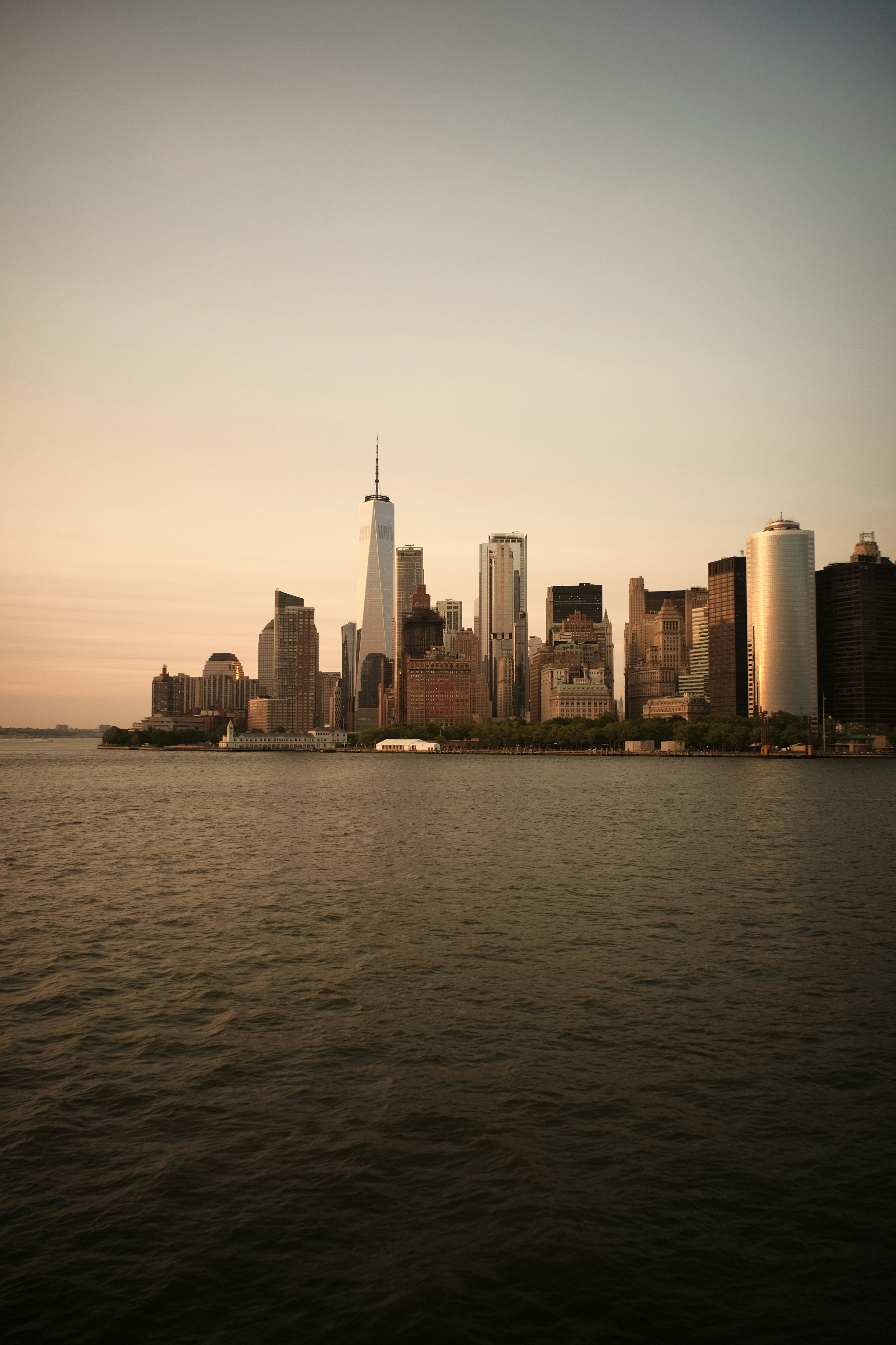 a large body of water with a city in the background