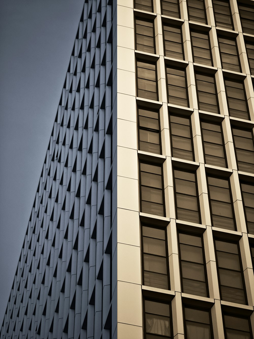 a tall building next to a smaller building