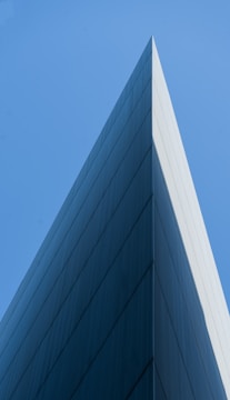 a tall building with a sky in the background