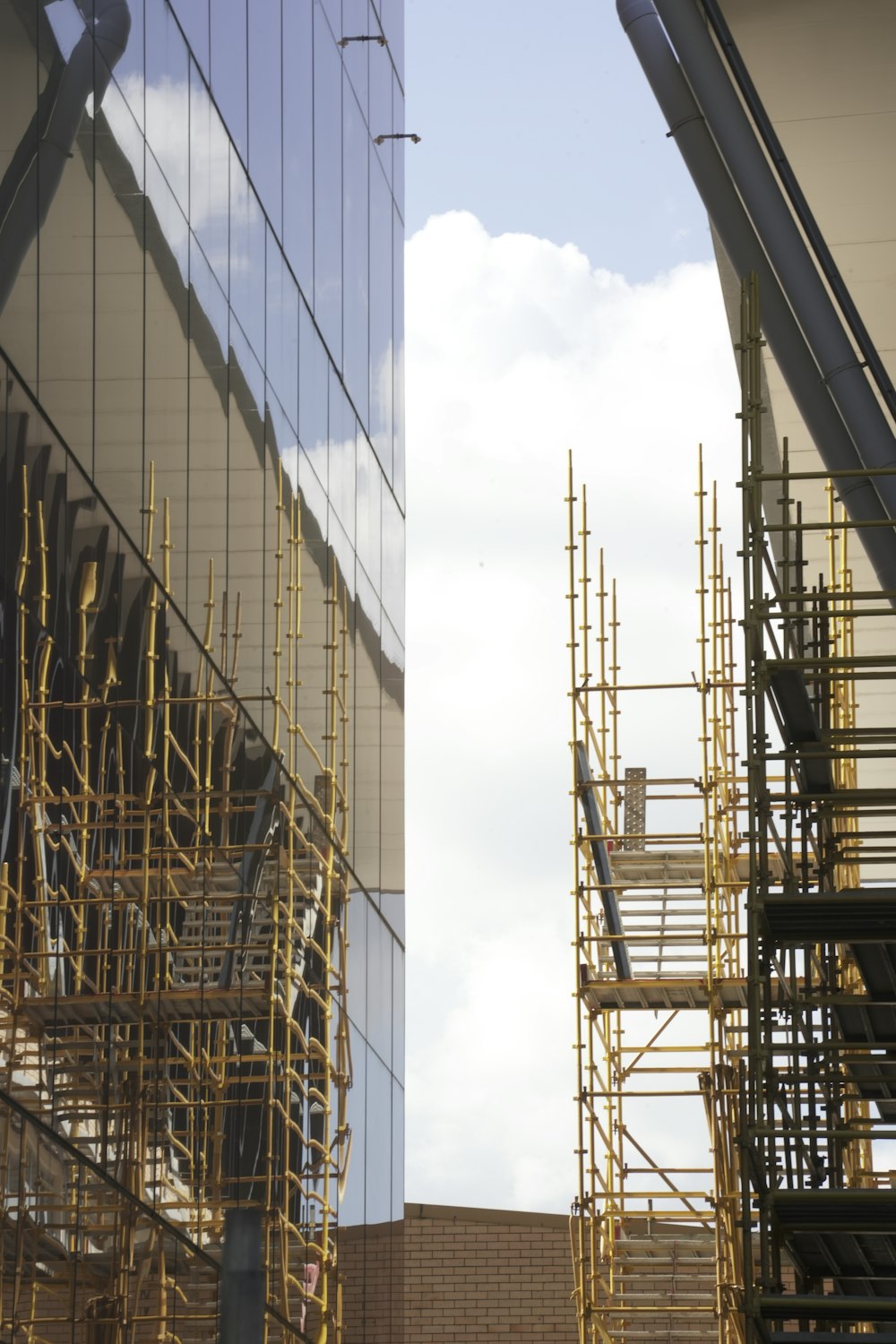 a tall building with scaffolding next to it