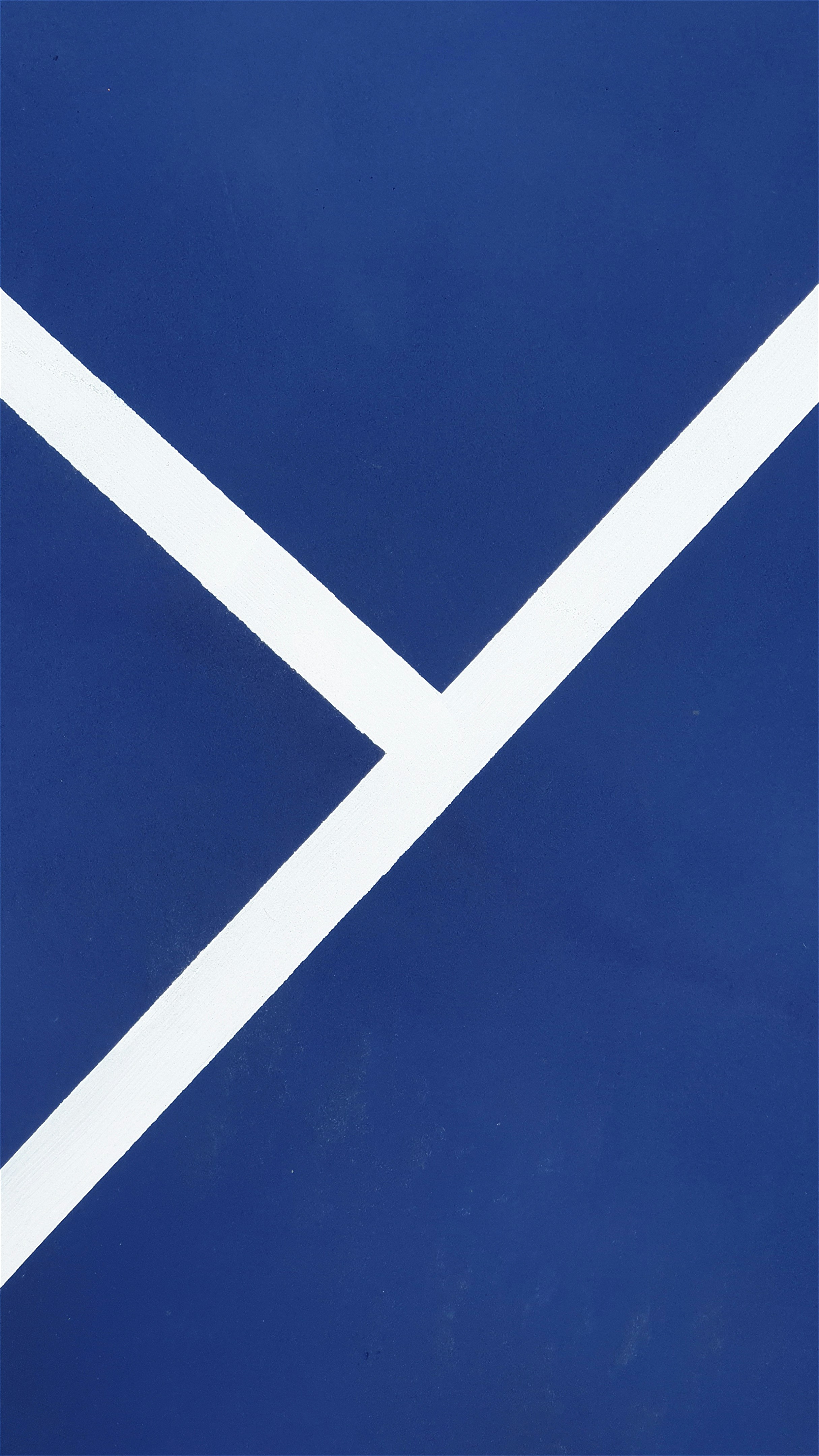 a close up of a blue and white wall