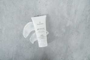 Artistic shot of dseyia llc hand cream being squeezed out in soft sunlight.