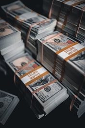 a pile of twenty dollar bills sitting on top of each other