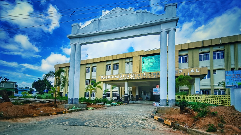 a large building with columns and a clock on the front of it