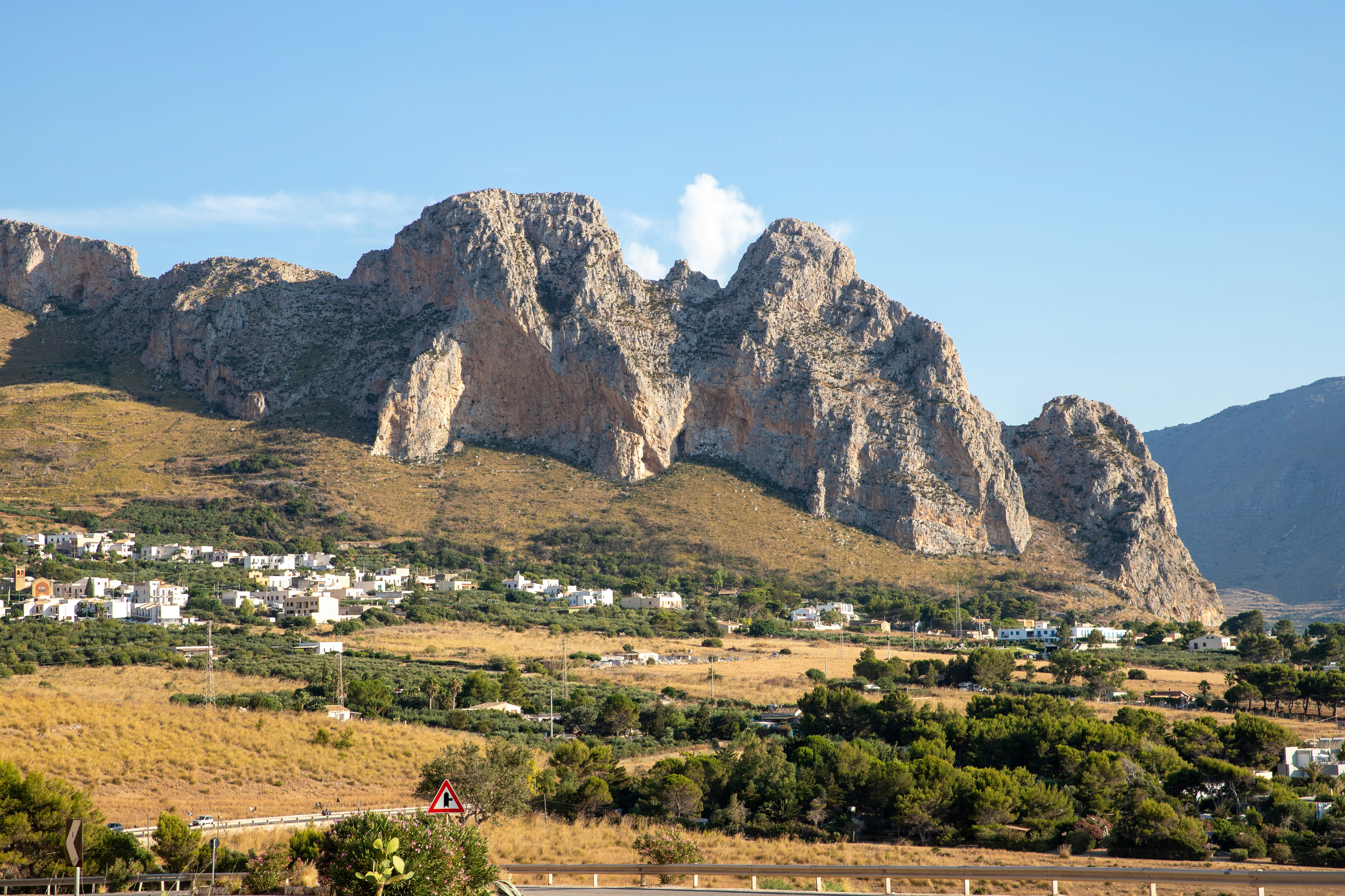 a view of a mountain range with a town below, Macari Viewpoint Breathtaking Landscape