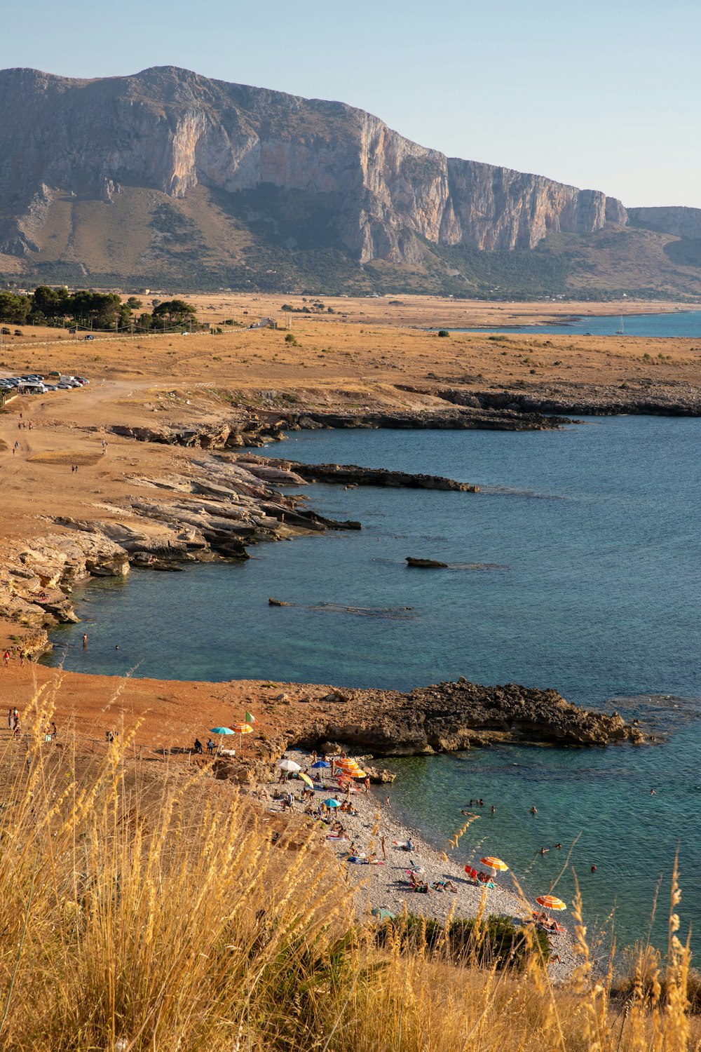 a body of water with a mountain in the background