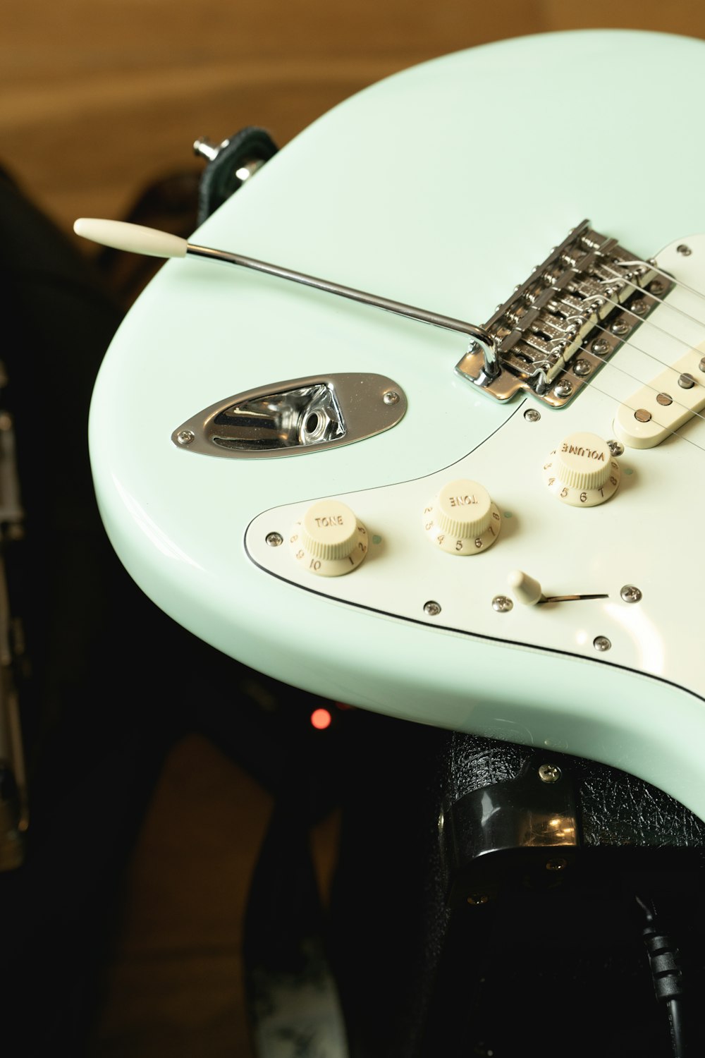 a close up of a blue electric guitar