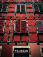 Freshly painted facade with traditional stonework and wooden shutters in Saint-Malo intra-muros