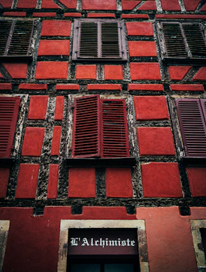 Freshly painted facade with traditional stonework and wooden shutters in Saint-Malo intra-muros