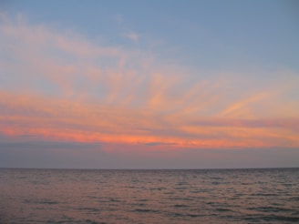 A calm ocean view at sunset, symbolizing peace and reflection.