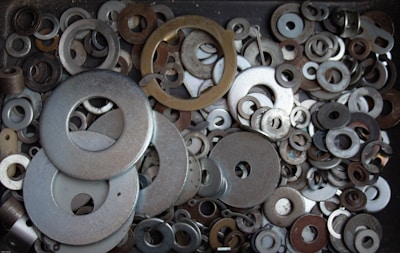 Close-up of plastic spacers and shim pads in various sizes.