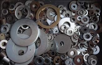 A collection of siphonic plumbing materials including omega and clamps.