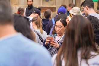A woman using a mobile app in a public space.