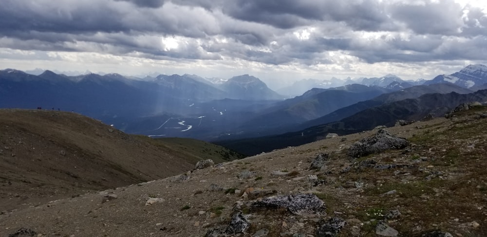 a view of a mountain range with a cloudy sky