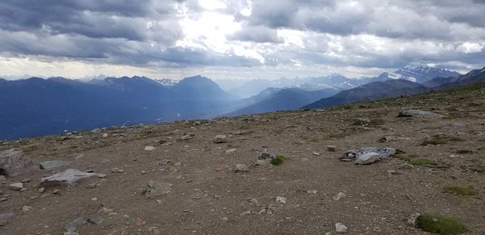 a view of a mountain range with a cloudy sky