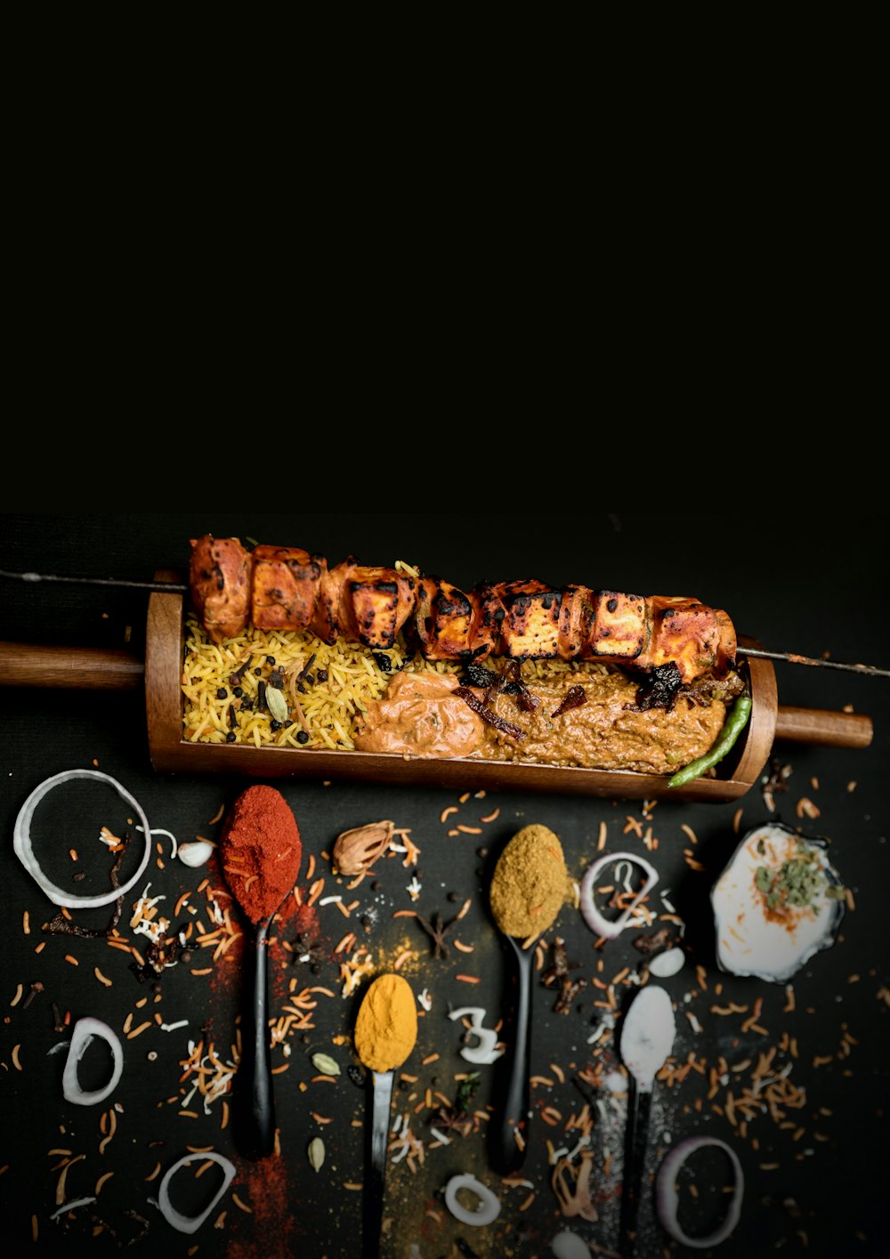 a wooden tray filled with food on top of a table