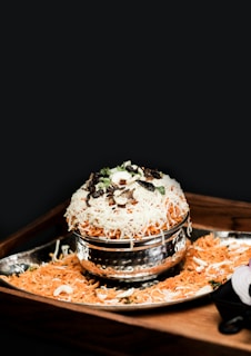 a plate of food on a wooden tray