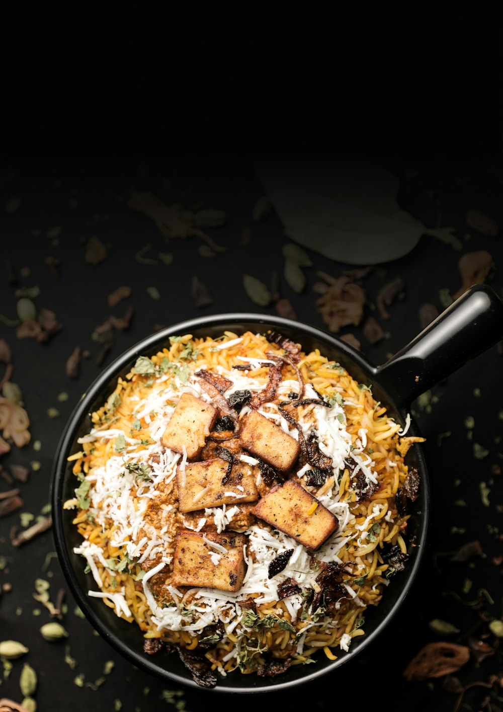 a pan filled with food on top of a table