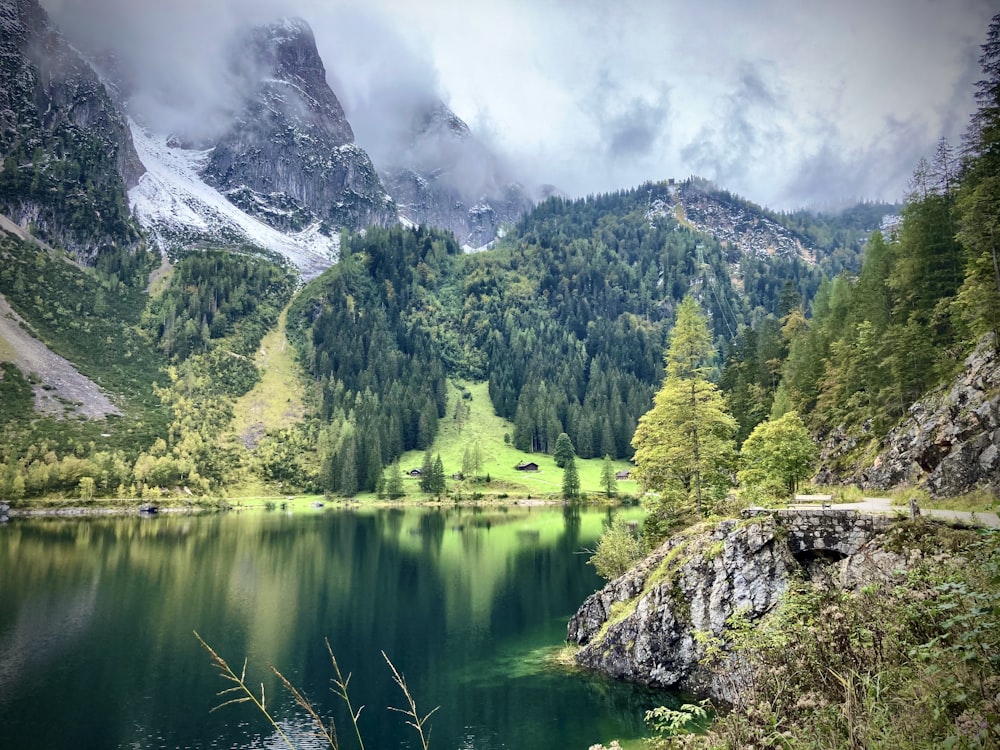 a lake surrounded by mountains and trees