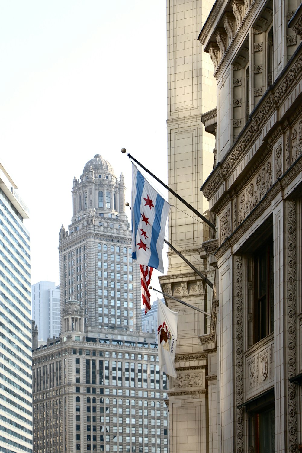 a city street with tall buildings in the background