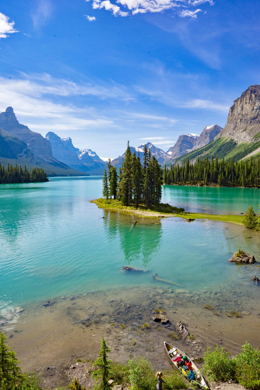 a body of water surrounded by mountains and trees