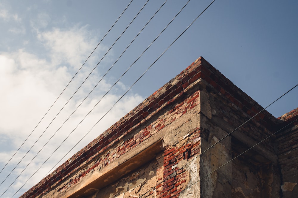 a brick building with power lines above it